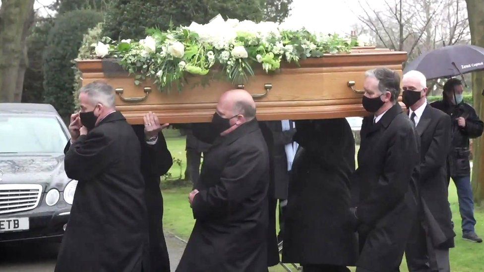 Coffin carrying Colin Bell taken into his funeral