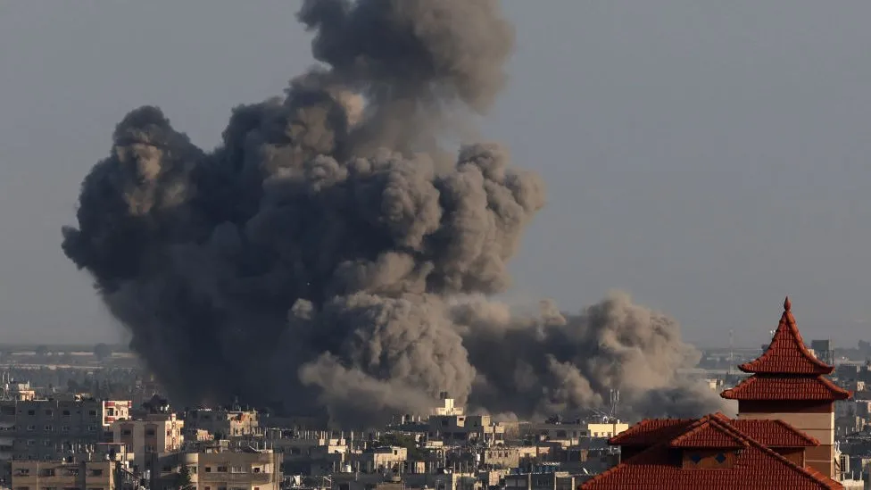 A picture taken from Rafah shows smoke billowing over Khan Younis during Israeli bombardment on Thursday