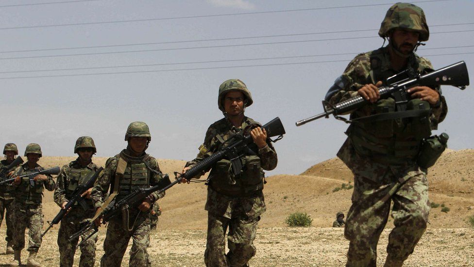 Afghan National Army (ANA) soldiers conduct a patrol outside the village of But Khak on the outskirts of Kabul May 15, 2012