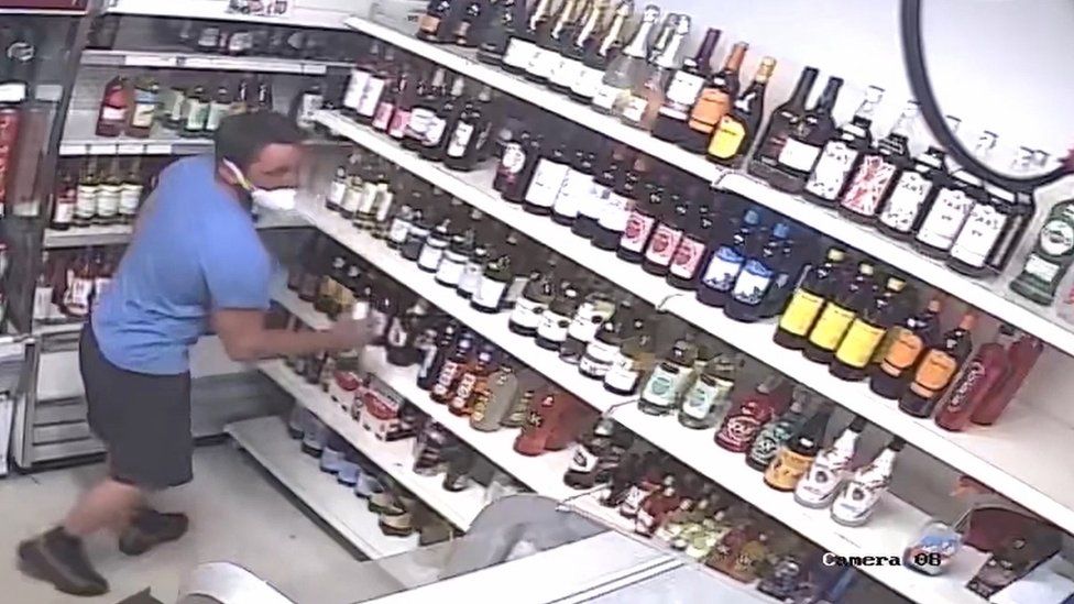 CCTV of Darren Jacques buying beer