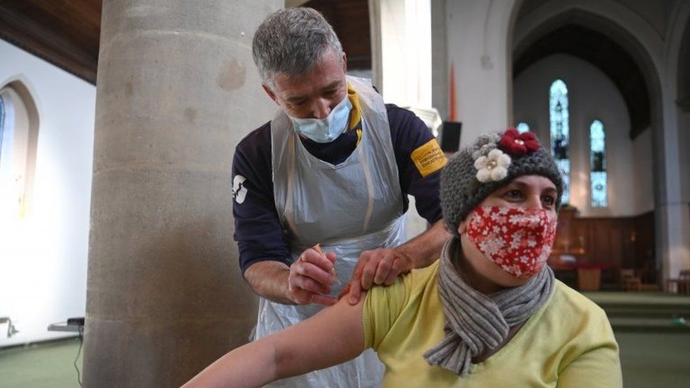 Woman receiving vaccine