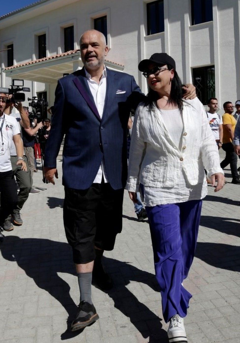 Albania's Prime Minister Edi Rama and his wife Linda Rama leave the polling station, near Tirana