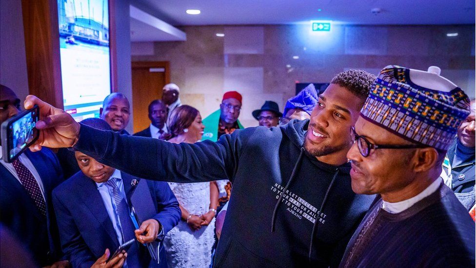 Anthony Joshua taking a selfie with Muhammadu Buhari