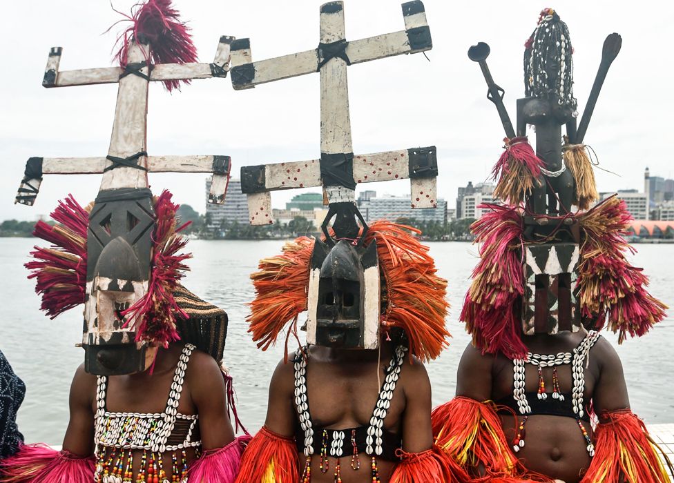 Malians in Dogon masks pictured in Abidjan, Ivory Coast - Wednesday 11 March 2020