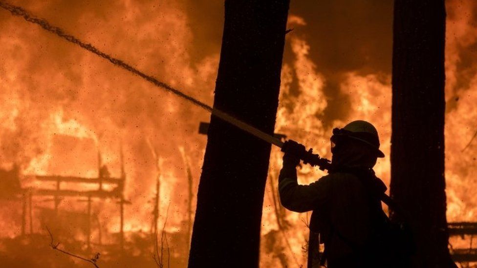 A firefighter battles the Camp Fire blaze in Paradise, California