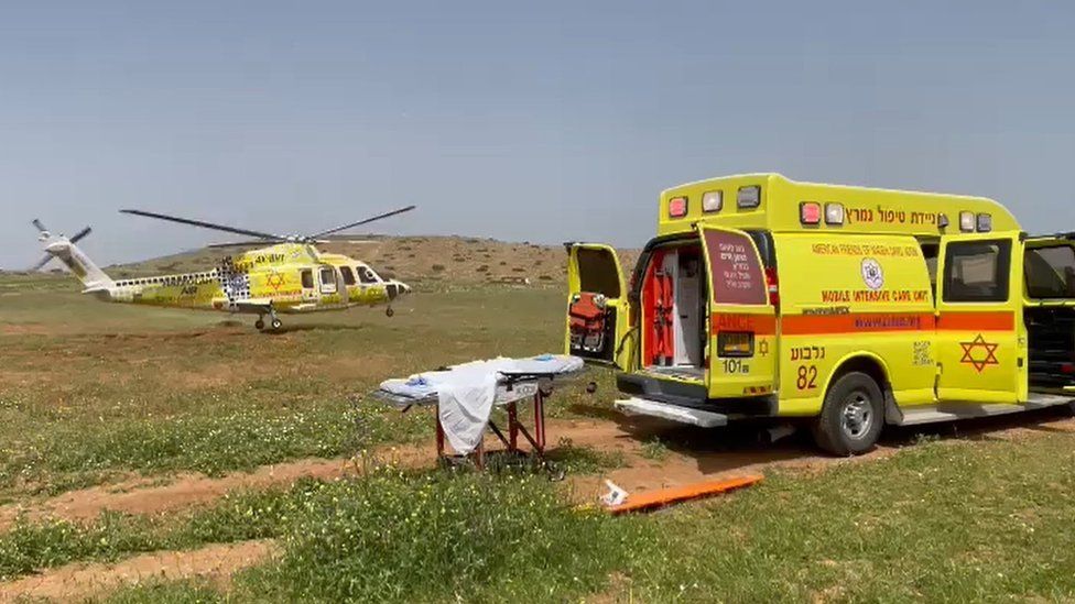 Screengrab from Magen David Adom ambulance service video showing a helicopter evacuating an Israeli woman who was seriously injured in a shooting attack in the occupied West Bank (7 April 2023)