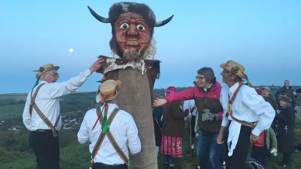 Wessex Morris Men welcome the May Day sunrise by the Cerne Abbas giant, Dorset