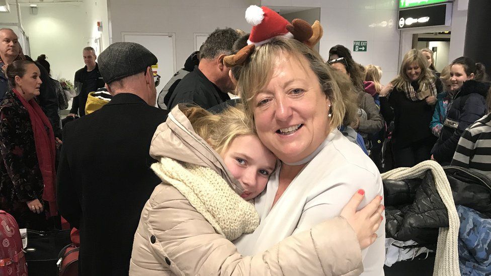 Host families waited at Gatwick airport on Friday to welcome the slightly delayed group of children