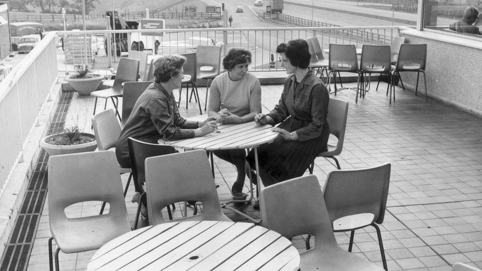 Women sat round a table at Leicester Forest East services