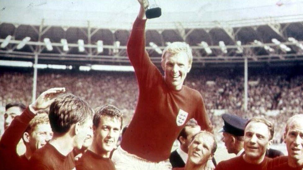 Bobby Moore, the England national football team Captain, being held aloft by his team mates after England had won the Jules Rimet trophy at the 1966 World Cup Final on 30 July, 1966