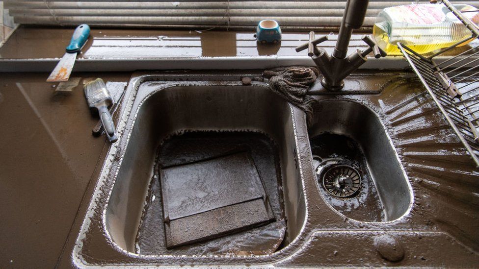 Flood dirty kitchen sink, after Storm Dennis