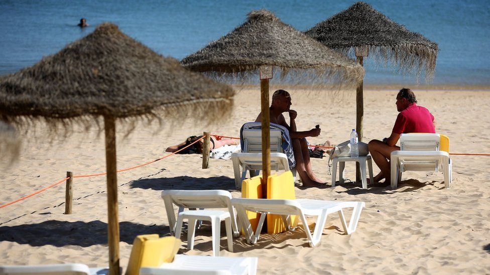 British tourists on the beach in Portugal