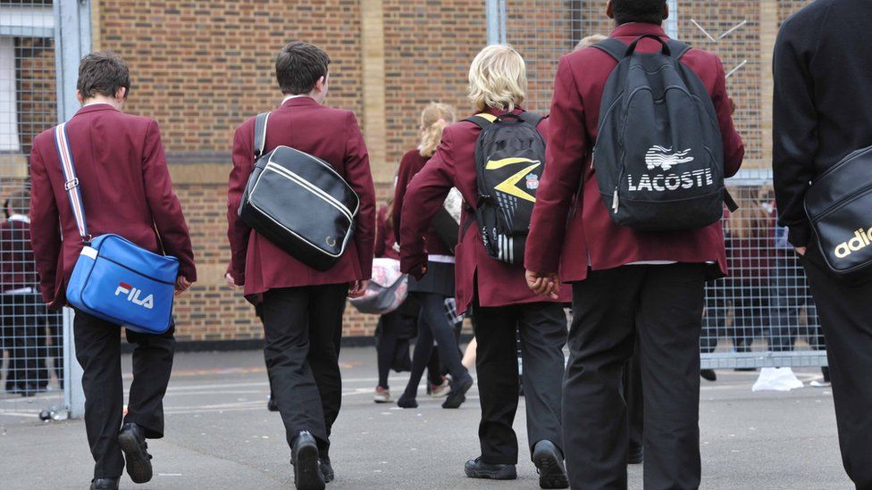 Boys walking into school