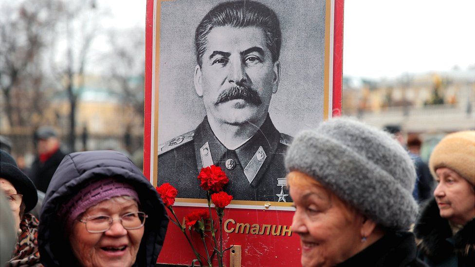 Women holding Stalin portrait in Moscow, 5 Mar 19