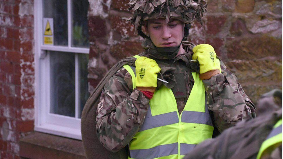 Soldiers helping with flood defences in Cumbria