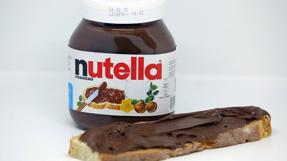 Jar of Nutella and piece of toast