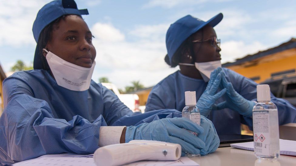 Nurses working with the World Health Organization (WHO) prepare to administer vaccines at the town all of Mbandaka on May 21, 2018 during the launch of the Ebola vaccination campaign.