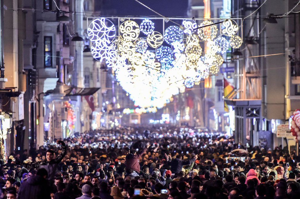 Revellers bid farewell to 2017 as they gather to celebrate New Years in Istanbul on December 31, 2017.