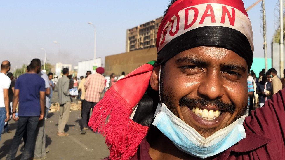 A Sudanese protester gestures during a rally in front of the military headquarters in the capital Khartoum on April 9, 2019.