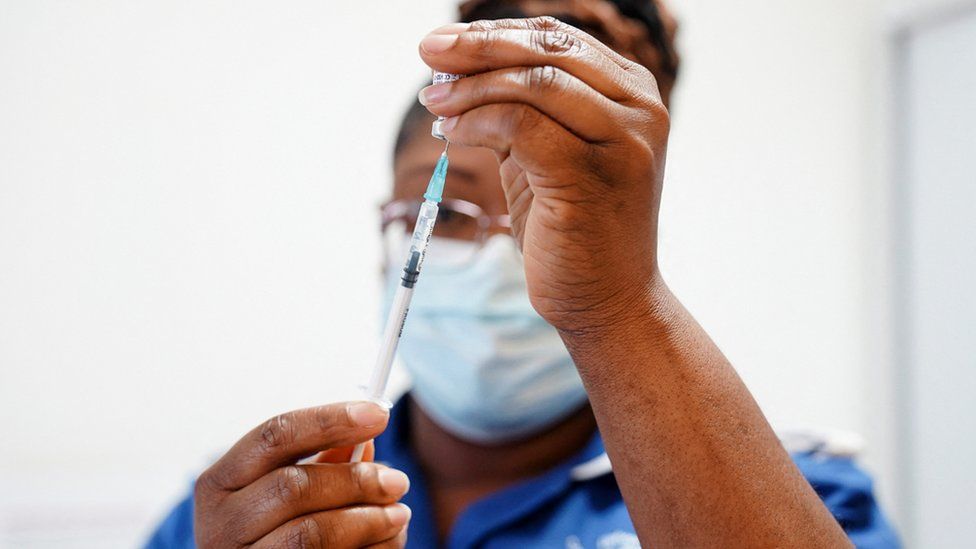File image of a nurse preparing a vaccine jab