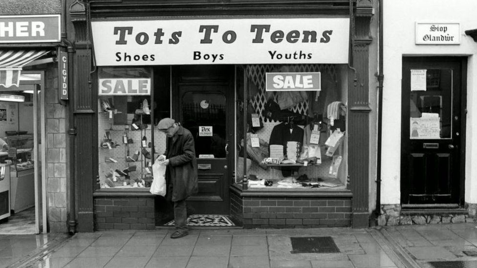 A man leaves the Tots to Teens shop in Pwllheli