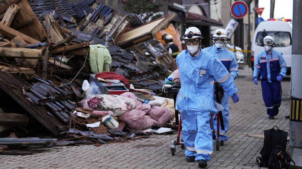 Rescue workers carry out an operation at a collapsed house following an earthquake in Wajima, Ishikawa Prefecture, Japan, 05 January 2024.