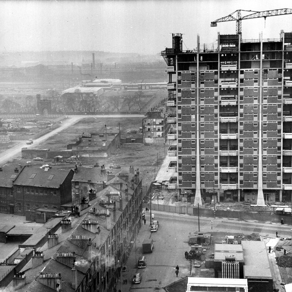 Modern housing under construction beside old tenements in the Gorbals area of Glasgow