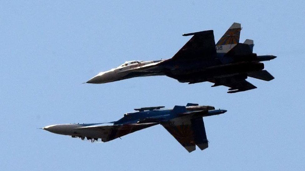 two Russian SU-27 aircraft perform during the International Maritime Defence Show (IMDS) in St. Petersburg, Russia, 07 July 2013