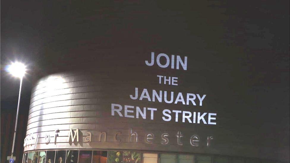 Projection urging rent strike