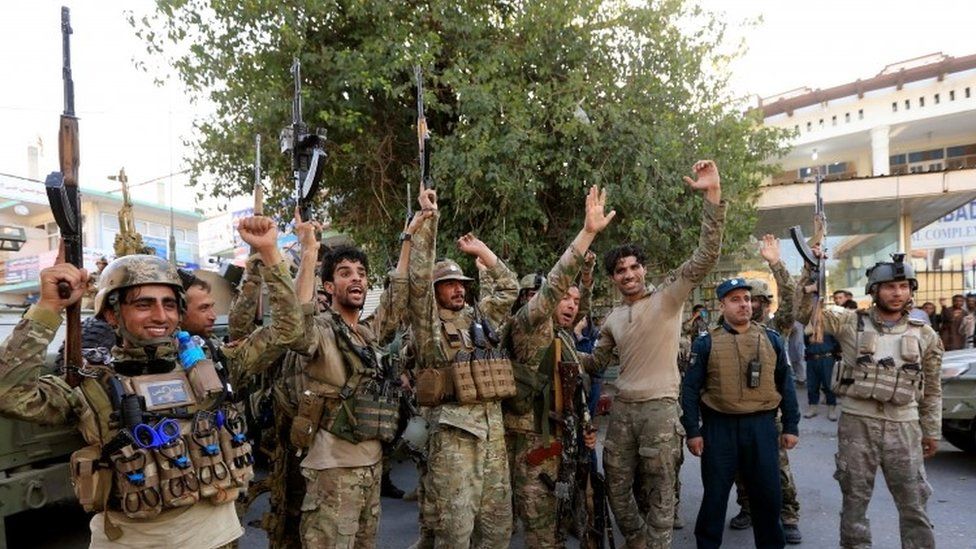 Afghan security forces celebrate neutralising gunmen who stormed a government building in Afghanistan's eastern city of Jalalabad, July 31 2018