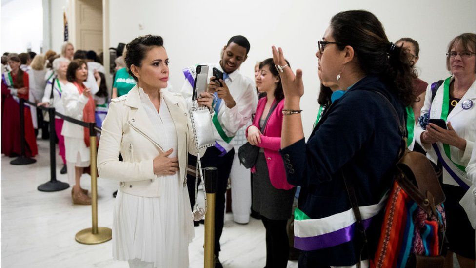Actress Alyssa Milano, using live twitter video, speaks with ERA activists waiting to enter the House Judiciary Constitution, Civil Rights and Civil Liberties Subcommittee hearing on the Equal Rights Amendment on Tuesday, April 30, 2019.