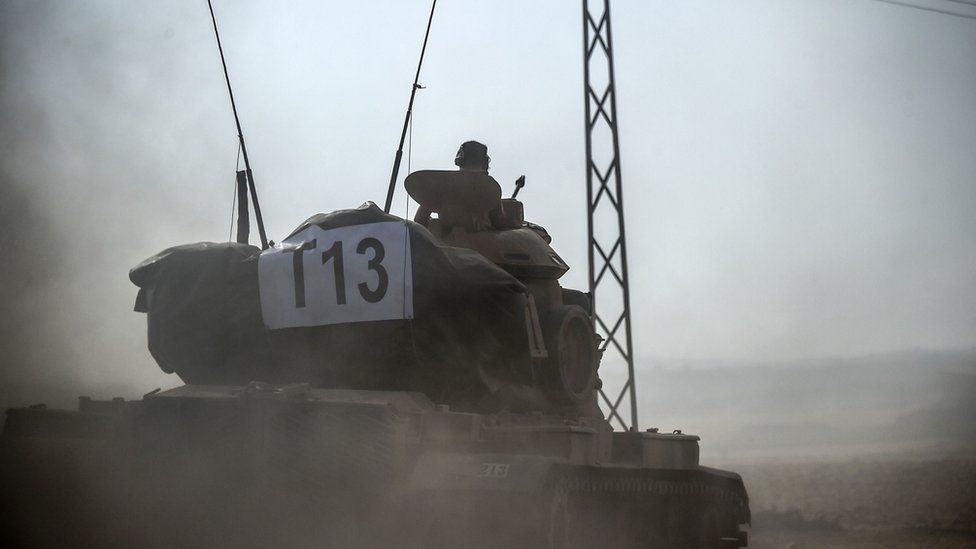 A Turkish tank heads towards the Syrian border, 24 August