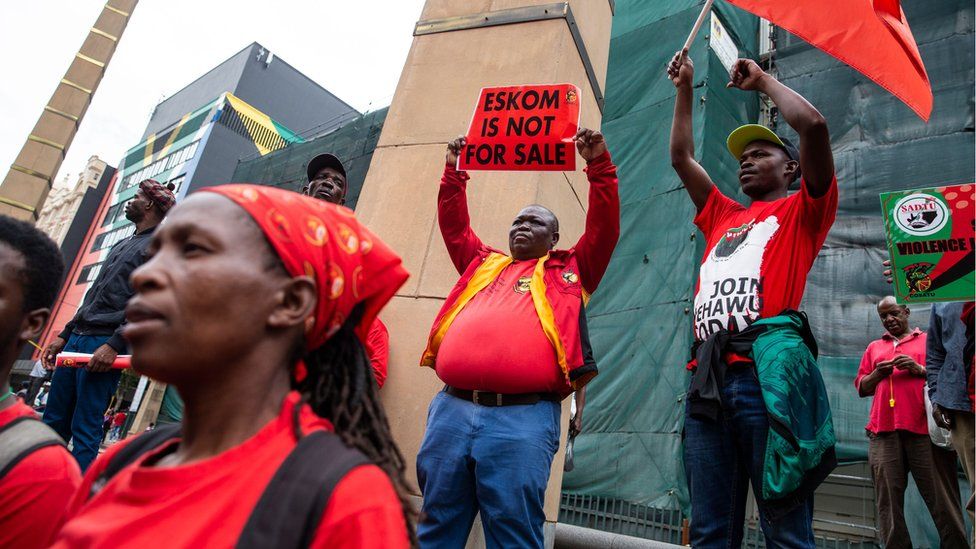 Trade union members protest over reports that the government might break Eskom into three entities