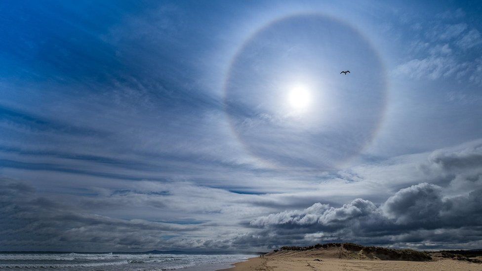 What is the source and the meaning of a large halo around the sun