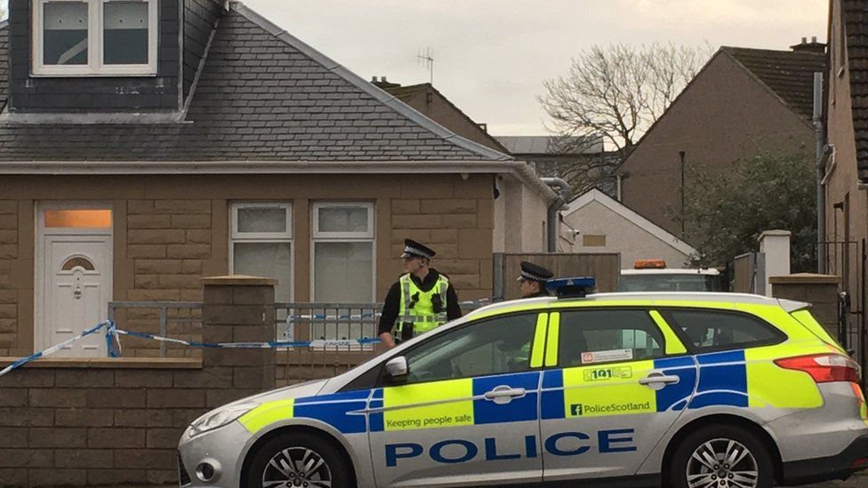 Police outside acid attack house