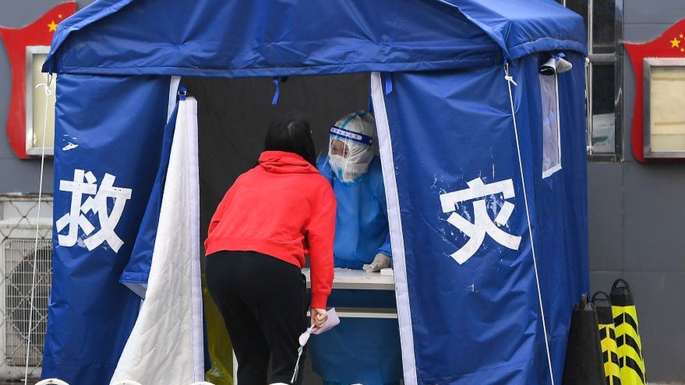A Beijing resident gets a Covid-19 swab test.