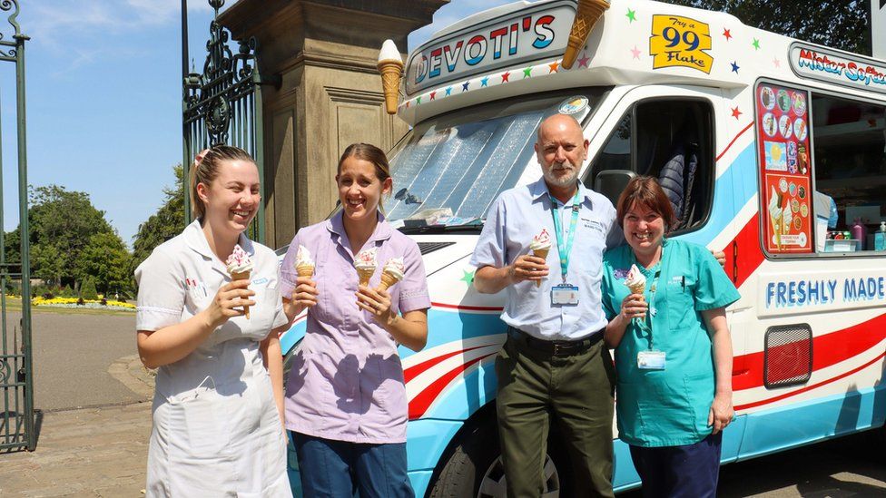 Sheffield Children's Hospital staff standing with ice creams next to ice cream van
