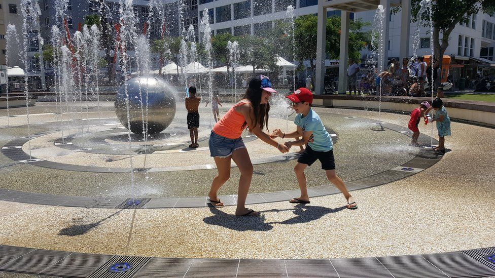 Children play in water feature in Netanya. Israel (file photo)