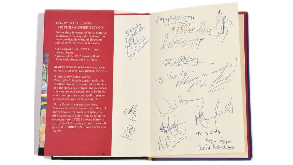 Cast autographs on the auctioned Harry Potter book