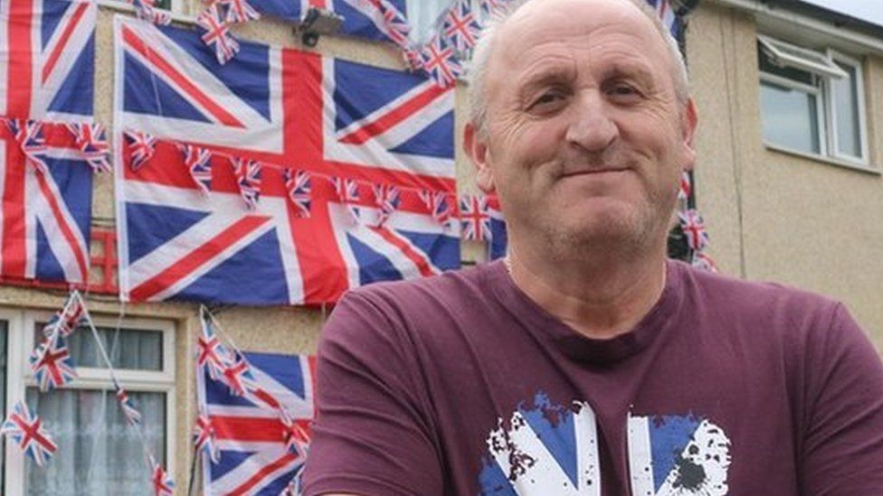 House covered in Union Jack flags