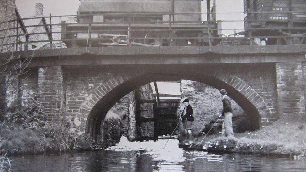 Boys fishing in the canal