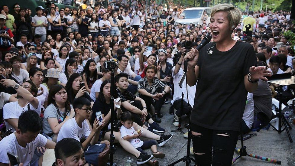 Denise Ho performs during a free concert in Hong Kong on June 19, 2016 after cosmetics giant Lancome cancelled a concert featuring the local singer, who is critical of China