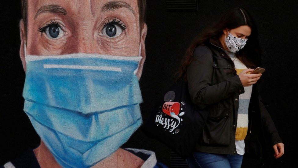 Woman wearing a mask in Manchester