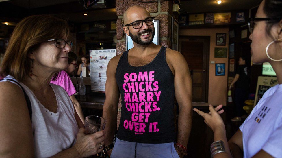 Man wearing T-shirt at event saying 'Some chicks marry chicks, get over it' in Bangkok, Thailand, 21 January 2017