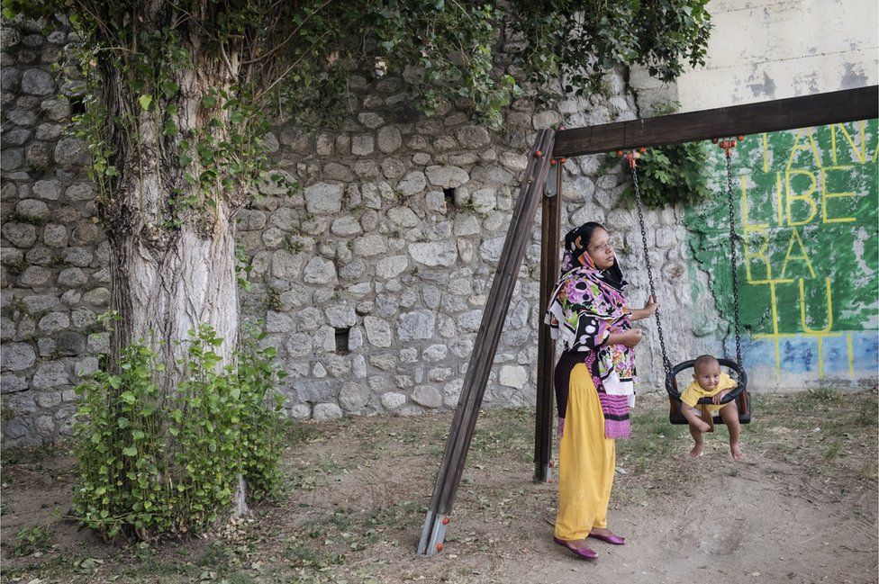 A woman from Bangladesh and her child in Riace
