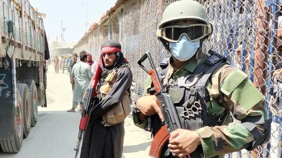 Taliban and Pakistani soldiers guard Afghanistan's border