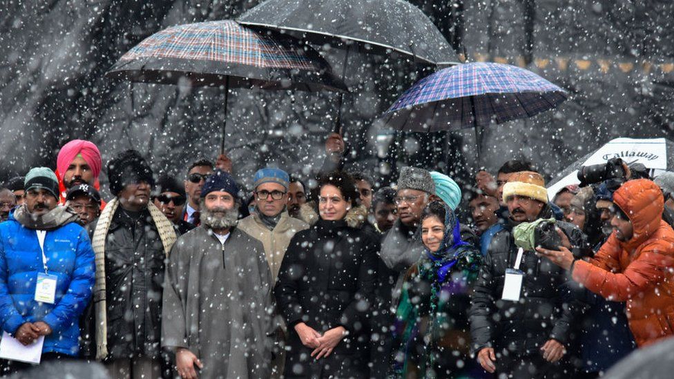 Indian National Congress leader Rahul Gandhi, Former chief Minister of Jammu andamp; Kashmir Omar Abdullah, general secretary of Indian National Congress Priyanka Gandhi and former Chief Minsiter of Jammu & Kashmir Mehbooba Mufti attend the public rally as it snows during the last day of 'Bharat Jodo Yatra' march in Srinagar.
