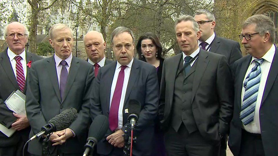 Nigel Dodds and other DUP MPs addressing journalists