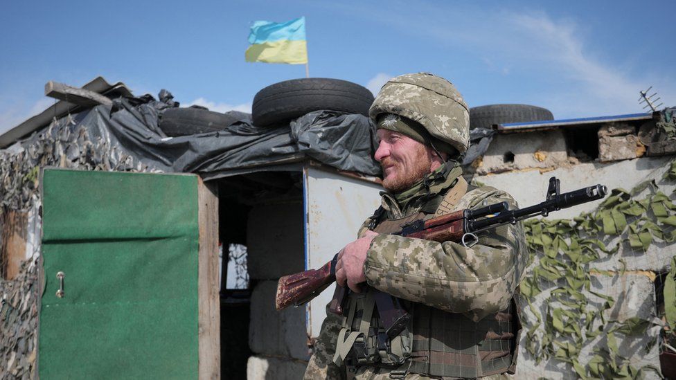 A Ukrainian soldier patrols at the checkpoint in the village of Shyrokyne near Mariupol. Photo: 26 April 2021