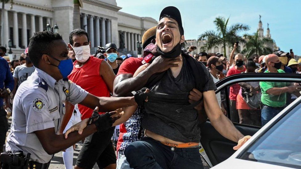 A man is arrested during a demonstration against the government of Cuban President Miguel Diaz-Canel in Havana